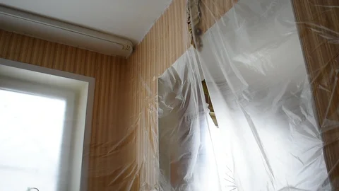 Passage in the room is covered with cellophane Stock Footage 125367429