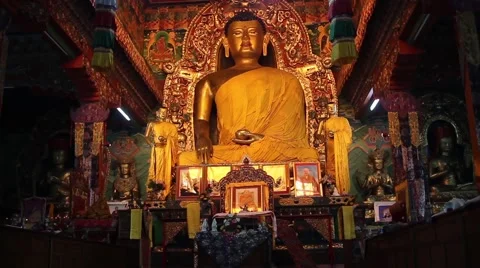 The passage by the slider along the Buddha statues. Slider/dolly shot Stock Footage 59012554
