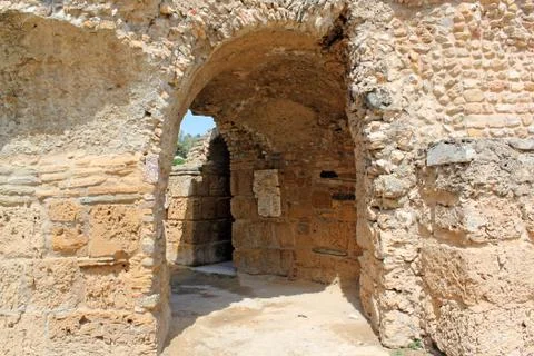 The passage in the stone wall Stock Photos