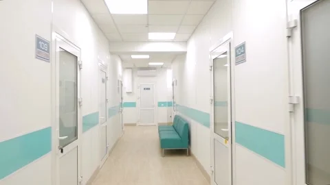 Passage through a long empty hospital corridor. First person view. Fly camera. Stock Footage 145428334