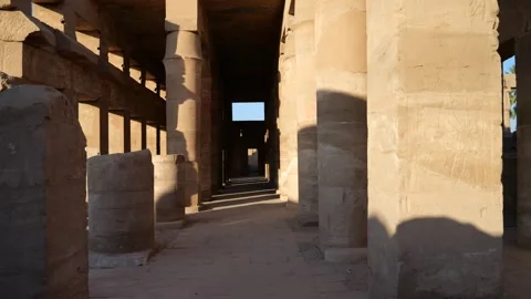 Passage Through Time: Exploring Karnak Temple's Columned Pathways - 4K Stock Footage 255725710