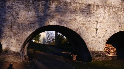 Passage Under an Old Stone Bridge Stock Footage 73499023