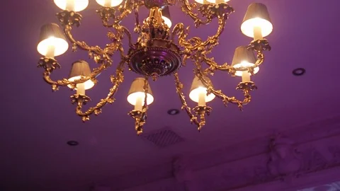 A passageway with a camera under a large beautiful chandelier and a painted Stock-Footage 122344224