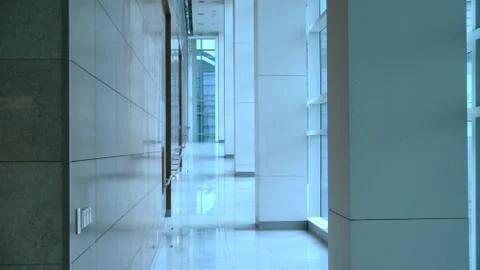 A passageway in a large building Stock Photos