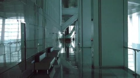 A passageway in a large building Stock Photos