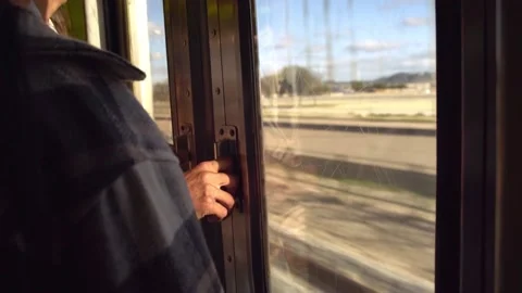 Passanger Holding Train Door With Outside View Through The Window Video stock 216189369