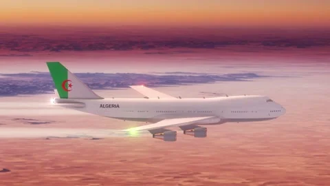 Passanger Plane Flying over Desert with Country Flag Algeria Stock Footage 286333370