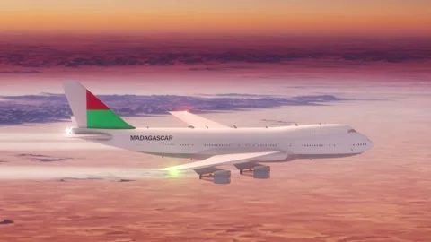 Passanger Plane Flying over Desert with Country Flag Madagascar Stock Footage 286334032