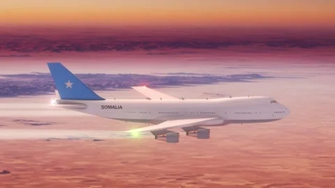Passanger Plane Flying over Desert with Country Flag Somalia Stock Footage 286334824