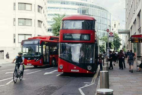 Passangers getting on a red doubledecker bus in London Stock Photos