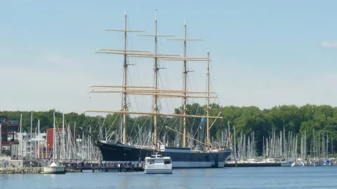 Passat sailing training ship with river Trave and Priwall ferry, Travemuende, L Video stock 132879880