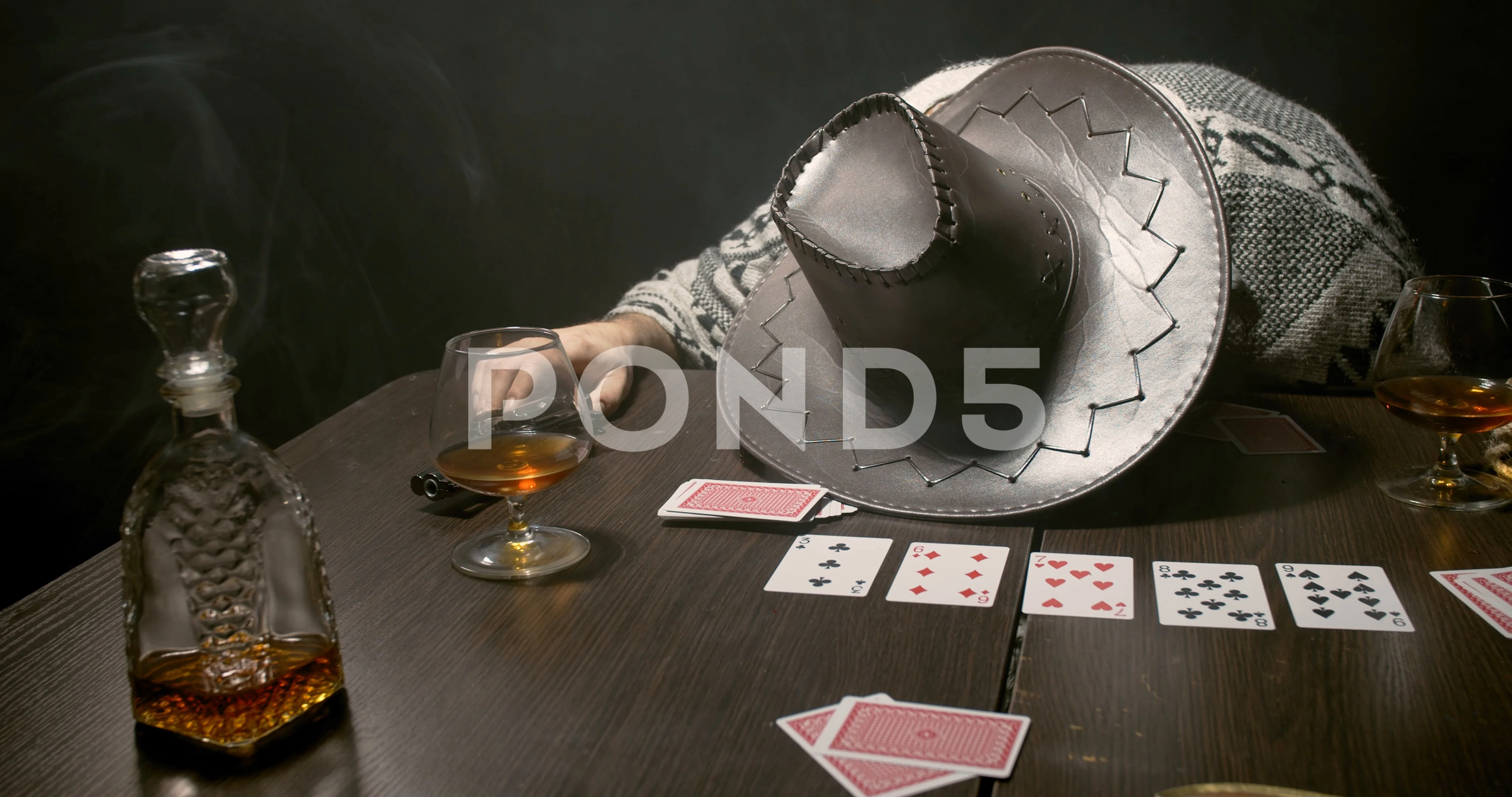 Passed out cowboy at the poker table in the bar, whiskey, guns and cards, 4k