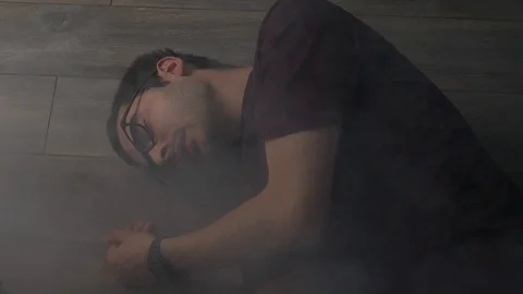 Passed Out Man On the Floor While Building is in a Fire Emergency Toxic Smoke Stock Footage 91191875