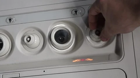 Passenger Adjusting Ventilation In Airplane Overhead Panel Stock Footage 144847758