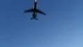 Passenger aircraft with lights flies above preparing for landing HD Footage