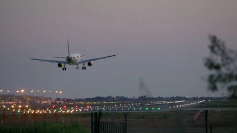 Passenger aircraft touching down in evening in Barcelona international airport 스톡 동영상 230284447