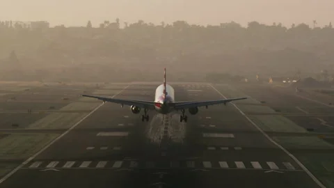 Passenger aircraft using chassis for landing along an airport runway 스톡 동영상 167718011