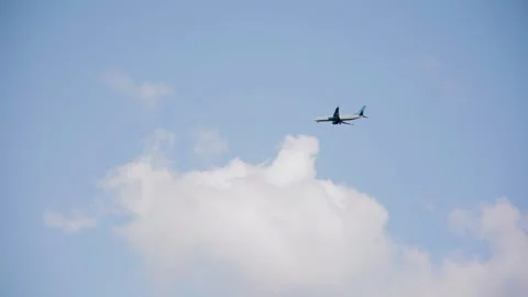 A passenger airliner is flying in the sky Stock Footage 328514134