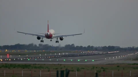 Passenger airliner touching down the runaway in Barcelona airport 스톡 동영상 230290233
