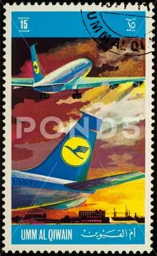 Passenger airliners on postage stamp Stock Photos
