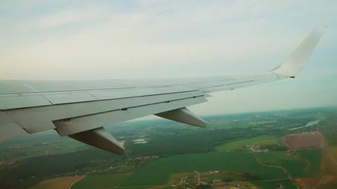 Passenger airplane climbing while hitting air pockets with flaps adjusting. Jet Stock Footage 317543142
