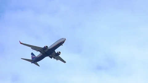 Passenger Airplane In The Clouds Close Up Stock Footage 126552760