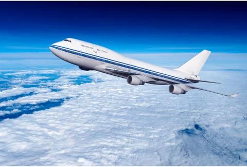 Passenger airplane in the clouds Stock Photos