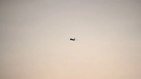 Passenger airplane flying high in the sky Stock Footage 158679042