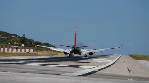 Passenger Airplane Landing and Touchdown on Runway at Skiathos Airport Stock Footage 340258597