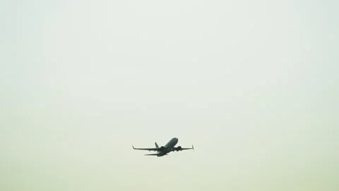 Passenger airplane taking off into a clear sky. Aircraft climbing after 스톡 동영상 344028441