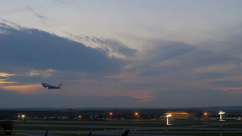 Passenger airplane taking off in the dusk Stock Footage 86607668