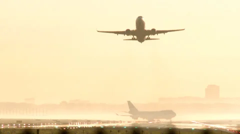 Passenger airplane taking off at sunset Stock Footage 37455557
