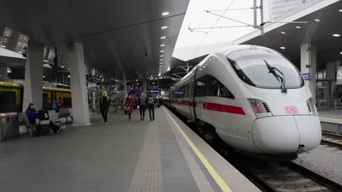 Passenger and Commuter on Platform at Vienna Train Station next to ICE 3 Train Stock Footage 231226283