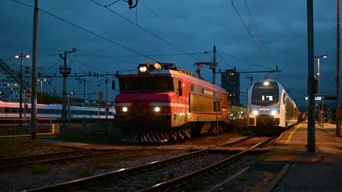 Passenger and freight train at train station platform in Ljubljana city Stock Footage 170664943