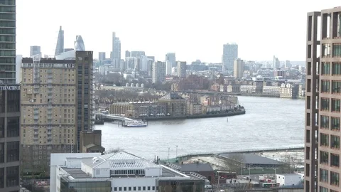 Passenger boat crosses frame on the Thames wide view locked off shot Stock Footage 74499239
