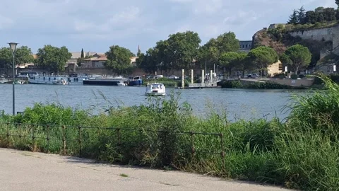 Passenger Boat Crossing the Rhône River to Barthelasse Island in Avignon 스톡 동영상 343255437
