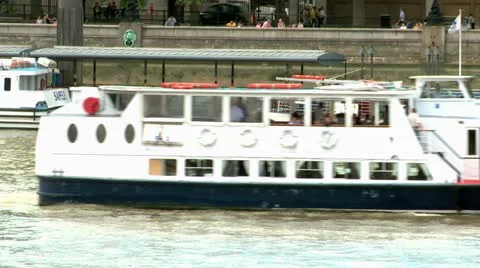 Passenger boat ferrying passengers down the thames Stock Footage 12135572