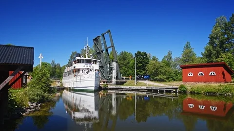 Passenger boat passing bascule bridge Stock Footage 96372811