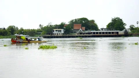 Passenger boat runs through the stream of Chao Phraya river in Thailand Stockbeeldmateriaal 61207112