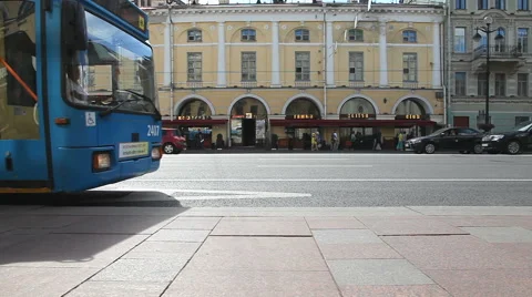 Passenger bus pulls up to the bus stop on Nevsky Prospect in the sunny day Stock Footage 58131294
