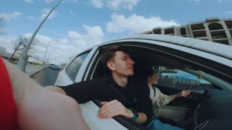 A passenger in a car with an open window Stock Footage 298839172