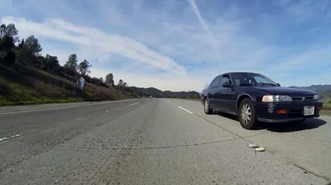 Passenger Car Passing on Freeway - low angle rear view Sonoma County Hwy 101. Stock Footage 21307580