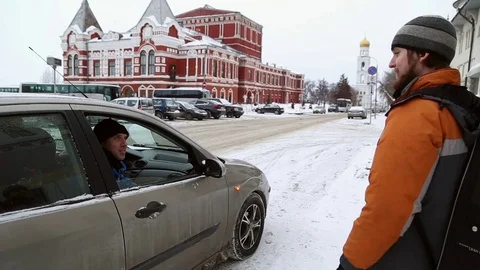 The passenger of the car talking to a pedestrian Stock Footage 72773570