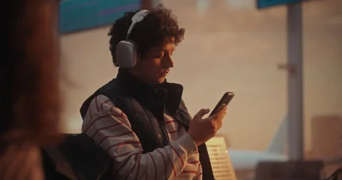 Passenger Checking Digital Flight Info on Smartphone While Airplane Departs Stock Footage 332565766