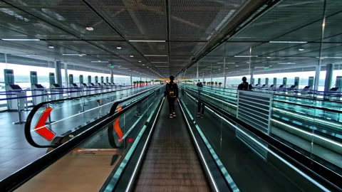 Passenger corridor with travelators at Charles de Gaulle Airport, Paris Stock Footage 323681233