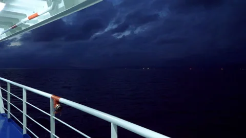 Passenger deck on a ship floating across the Mediterranean sea at night. 4K Video stock 121757038