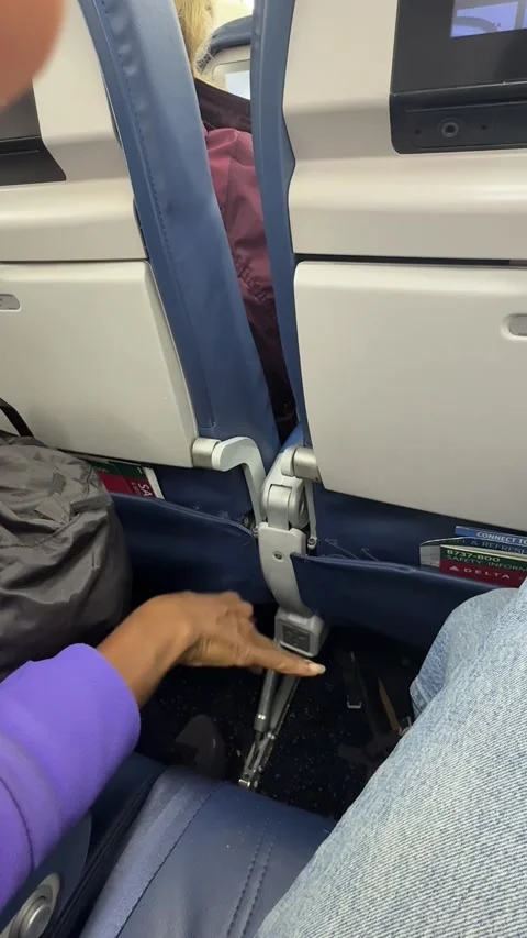 Passenger Discards Nut Shells Over Airplane Floor - 13 Sep 2025 Stock Footage 317565673