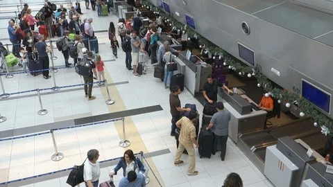 Passenger doing check in at airline counters at Ezeiza Buenos Aires Airport Stock Footage 113845677