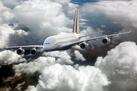 Passenger double decker plane in flight. Front view. Left heeling. Stock Photos