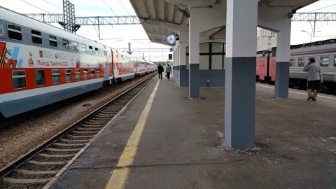 Passenger double-decker train stands at the platform at the station Stock Footage 312263465